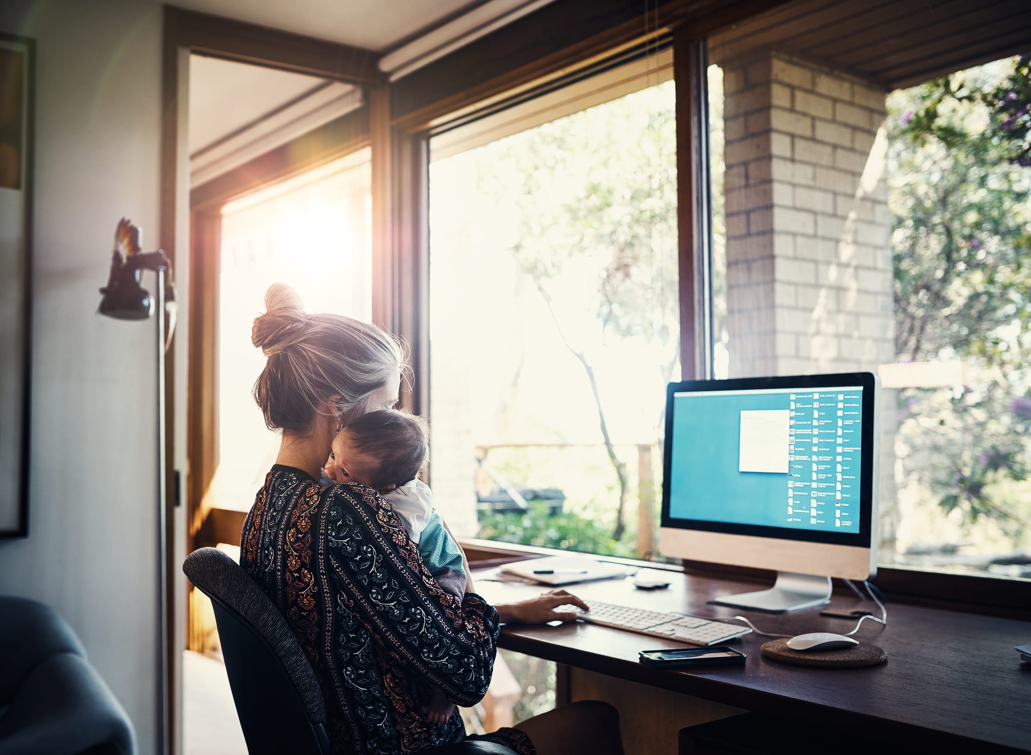 Woman researching vaccines on computer.